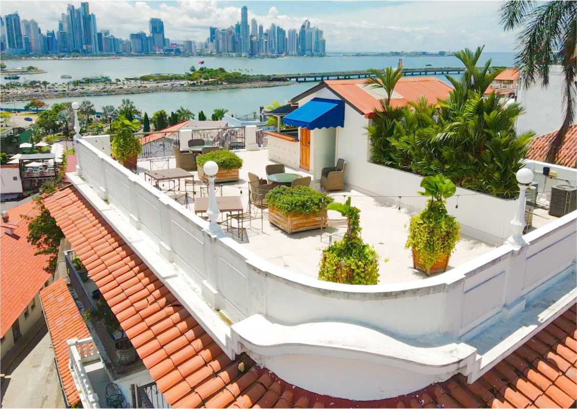 Panoramic rooftop terrace with city skyline and Panama Bay views at Las Clementinas Casco Viejo
