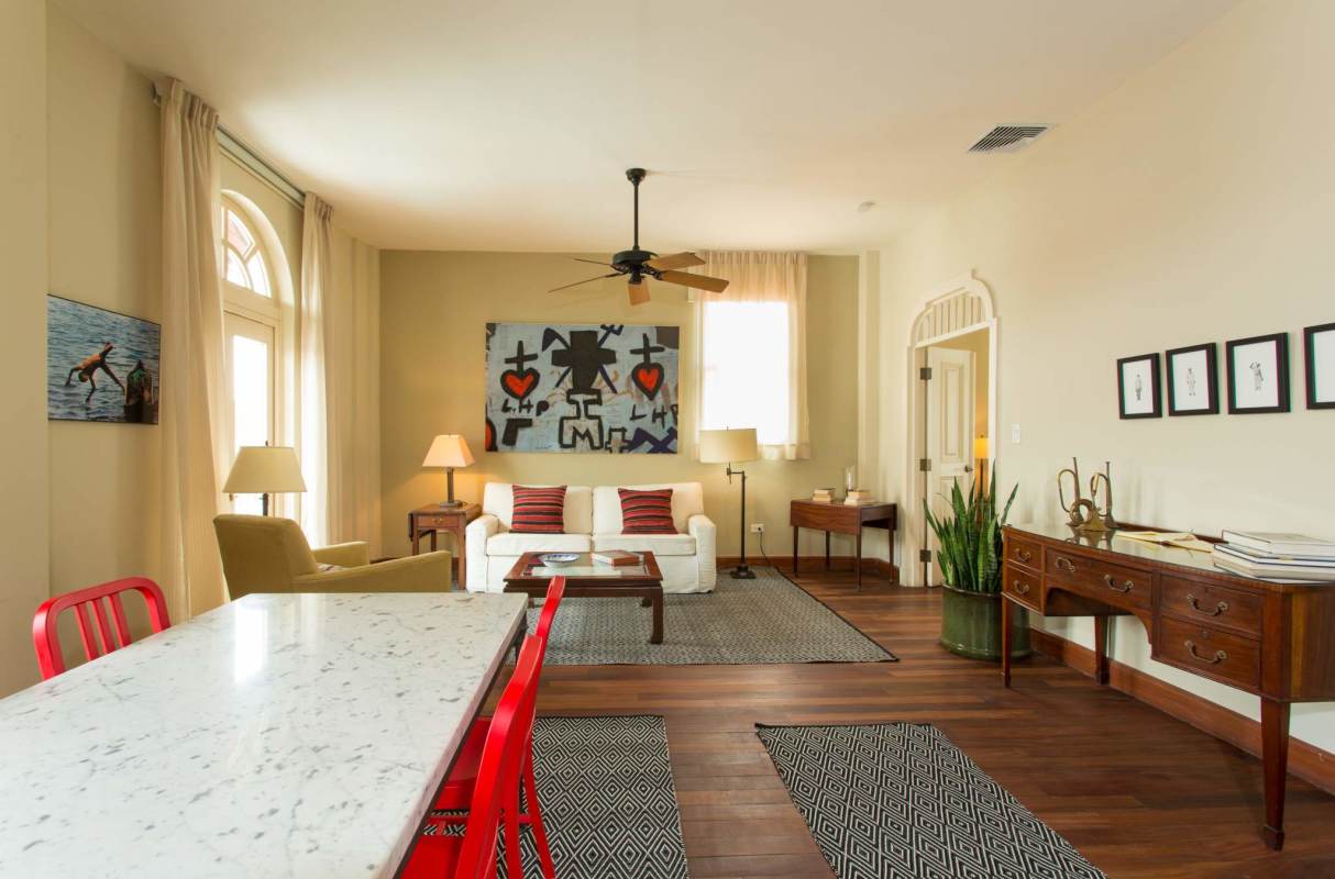 Spacious bright living area with vintage style, wood floors and decorative art Casco Viejo Panama