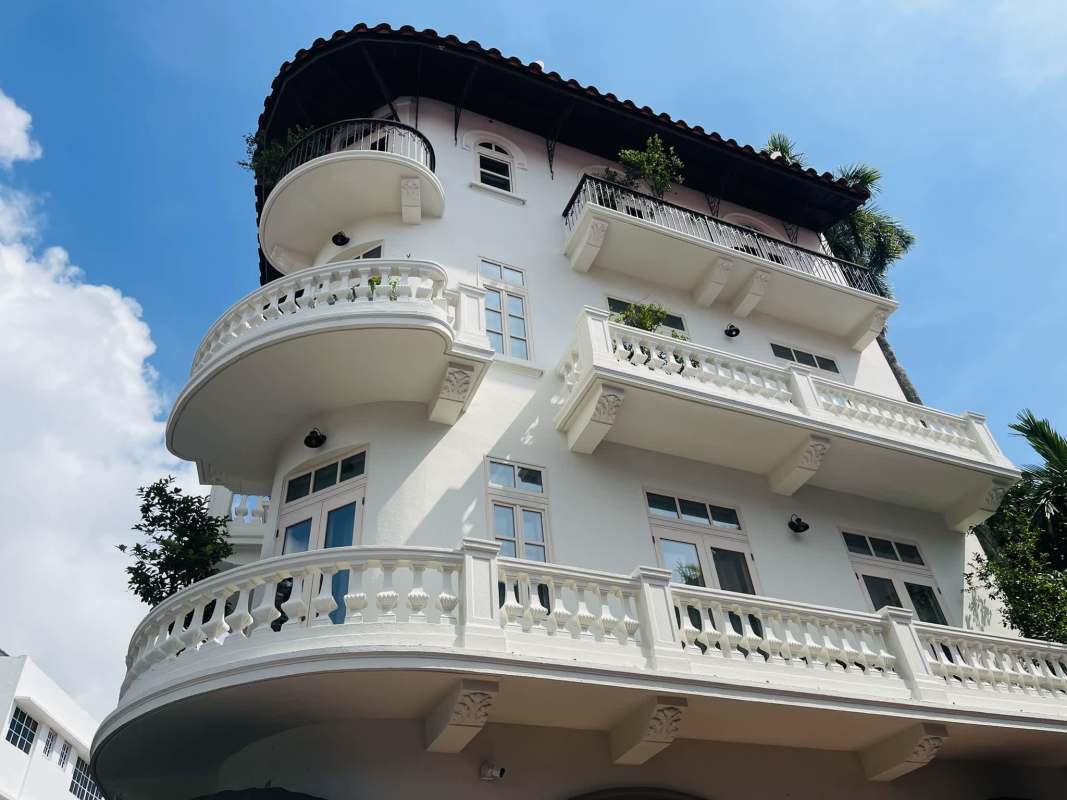 Open plan living dining with hardwood floors, bright windows at Las Clementinas Casco Viejo Panama