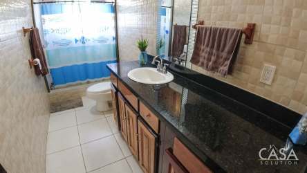 Bedroom pink painted walls mirrored wooden wardrobe tiled floor Bugaba Chiriquí Panama