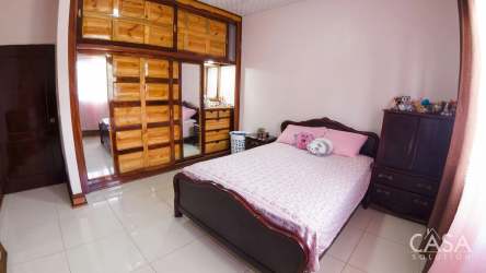 Contemporary bathroom granite counters tiled walls mirror single sink Bugaba Chiriquí Panama