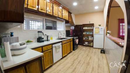 Spacious kitchen wood cabinetry tile backsplash large window Bugaba Chiriquí Panama