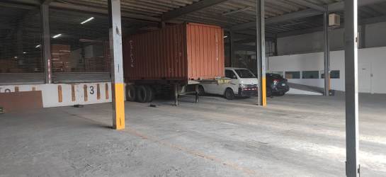 Large storage area with shelves and stacked boxes warehouse in Colon Free Zone Panama