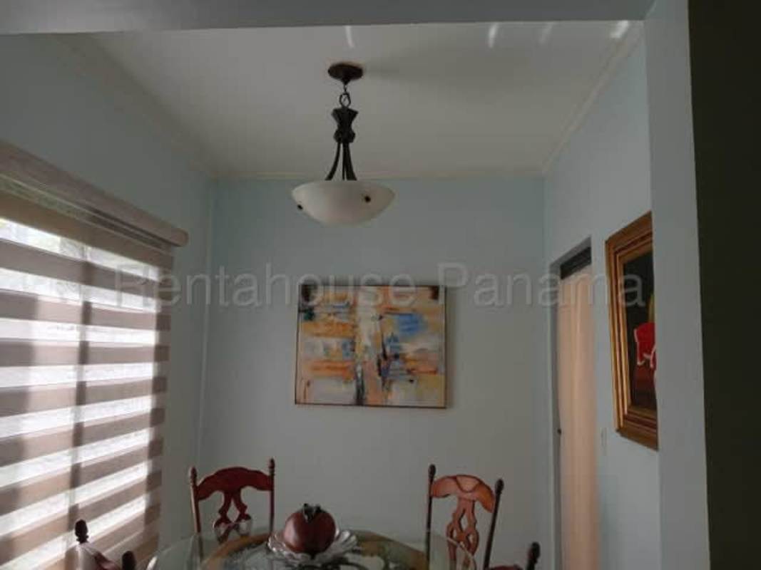 Elegant traditional dining room with glass table marble floors Residencial Antigua Panama