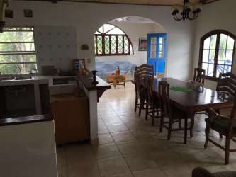 Living room with sofas, windows, Caribbean style decor beachfront rental Panama