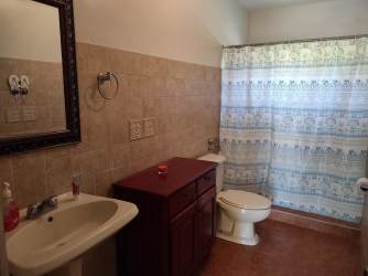 Tiled bathroom with vanity at house for rent Playa Corona Chame