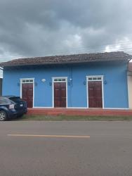 Simple large space used as meeting or dining room in house at La Villa de Los Santos