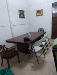 Historic colonial house exterior with blue facade wooden doors and clay roof Panama