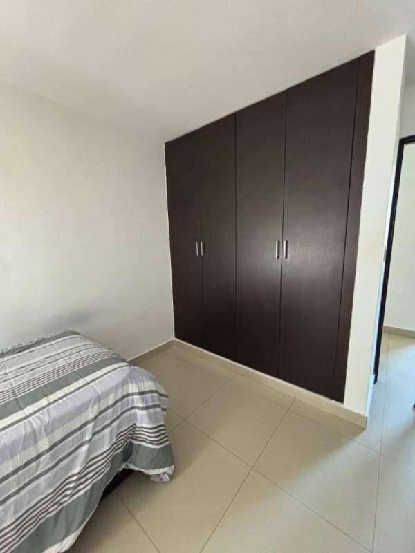 Single bedroom with dark wood closet in PH Albrook Condo Clayton Panama City