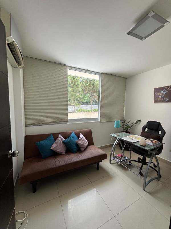 Contemporary home office with sofa, glass desk, large windows and AC in PH Albrook Condo Clayton Panama
