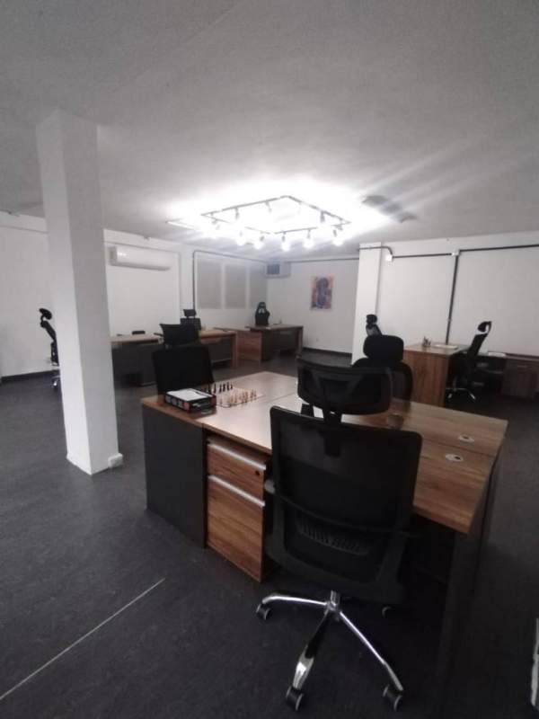 Minimalist modern open office with wood floors and white walls in El Cangrejo commercial center Panama