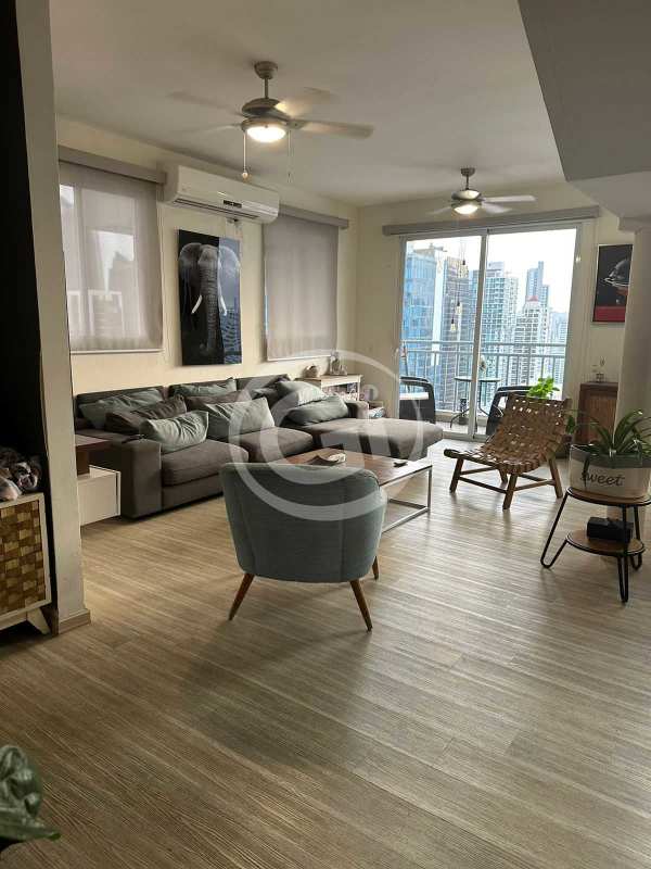 Modern double height living room with balcony and city view in penthouse PH Miyaki Panama City