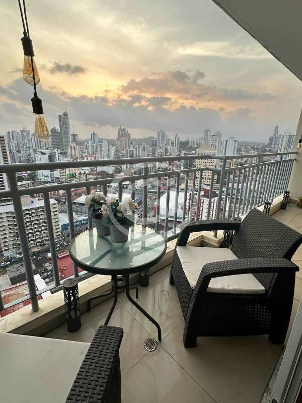 Penthouse balcony with furniture and sunset skyline view PH Miyaki Panama