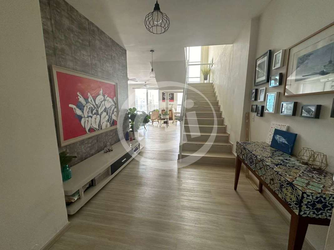 Hallway with framed photo gallery and modern stairs PH Miyaki Penthouse Panama City