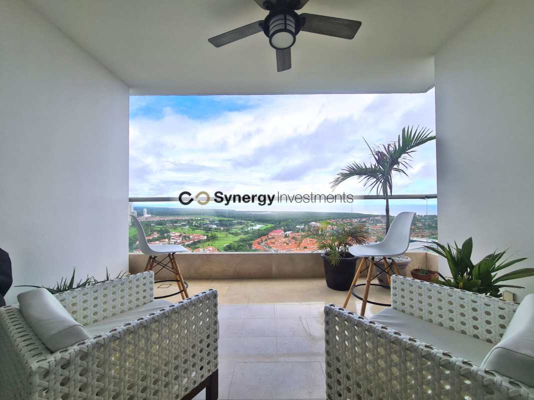 Bright open-plan living room with marble floors, large windows, and golf course views in Santa Maria luxury condo Panama