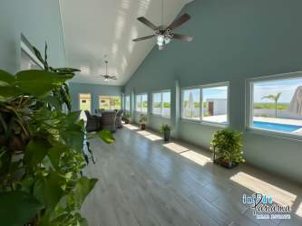Spacious beach house kitchen with granite countertops and wood cabinets Playa La Barqueta