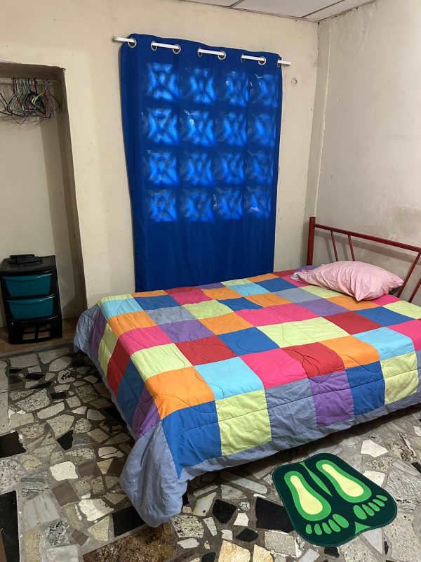 Bathroom with white toilet, pedestal sink and shower curtain in Villa Lobos Pedregal