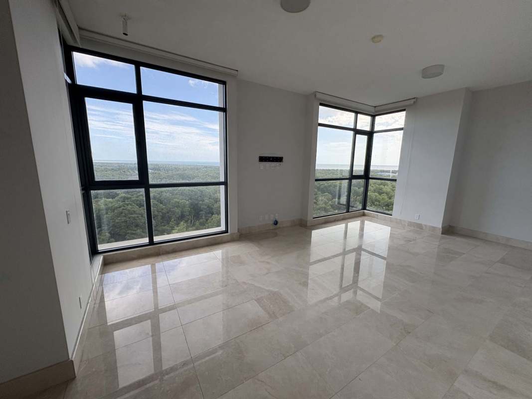 Gourmet kitchen with marble counters, central island, bright windows in Santa Maria Panama apartment