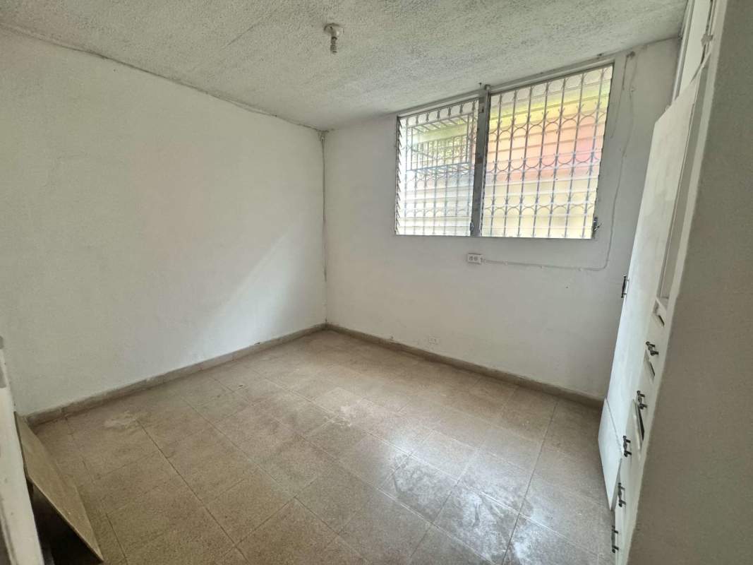 Small bedroom with built-in closet and secure window in affordable apartment Panama City