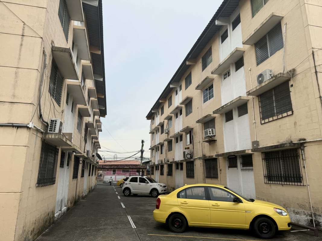 Multi-story apartment buildings with parking area and cars in Panama City