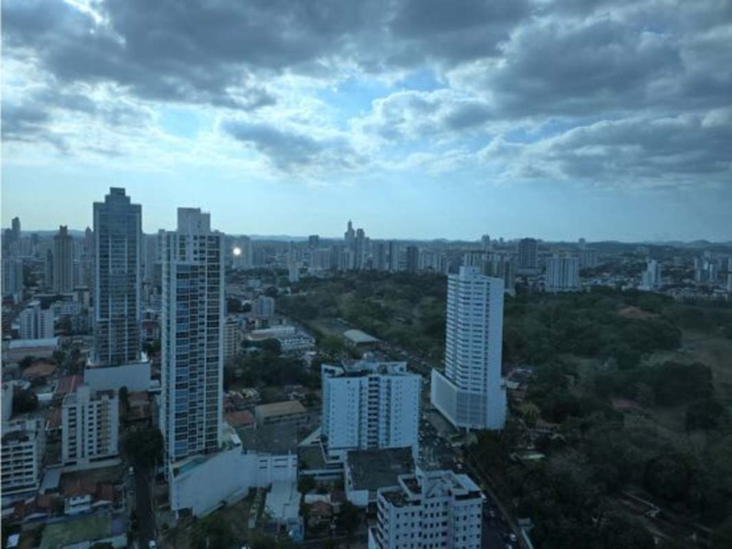 Private balcony with glass rail and panoramic views at PH Park Loft in Coco del Mar Panama City