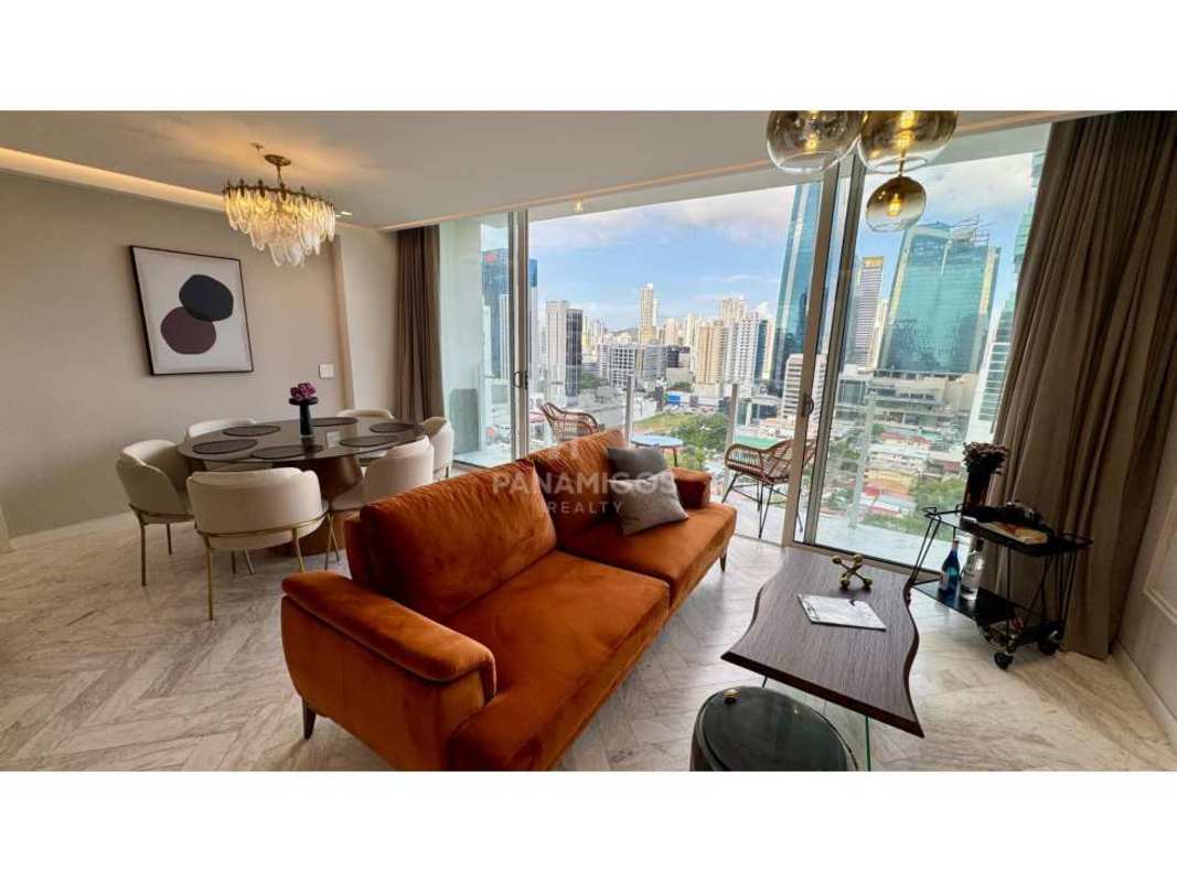 Spacious luxury living dining area with panoramic Panama City skyline views in Wanders & Yoo Marbella