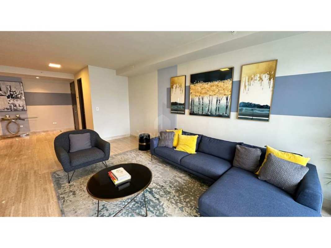 Modern bright living dining room with large windows and balcony access overlooking Pacific Ocean in PH Regent Costa del Este