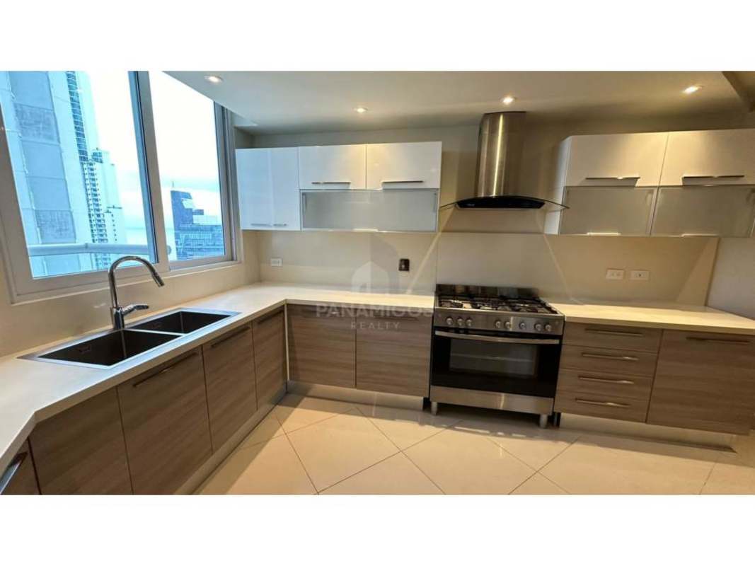 Contemporary kitchen with granite countertops, stainless appliances and city views in PH Regent Costa del Este Panama