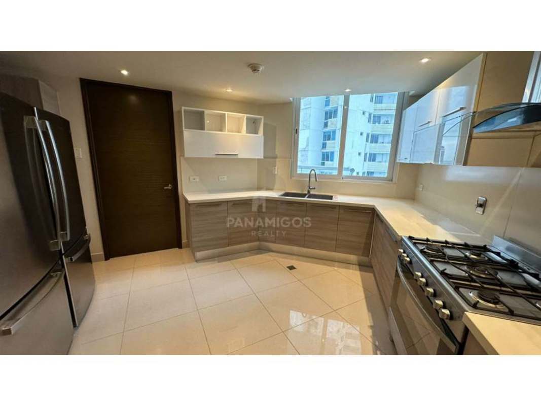 Spacious master bedroom with large panoramic windows, ocean city skyline views in PH Regent Costa del Este Panama