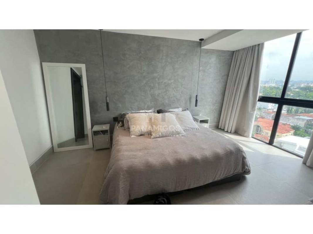 Elegant bedroom with large window city skyline view at Victory Wellness Coco del Mar Panama