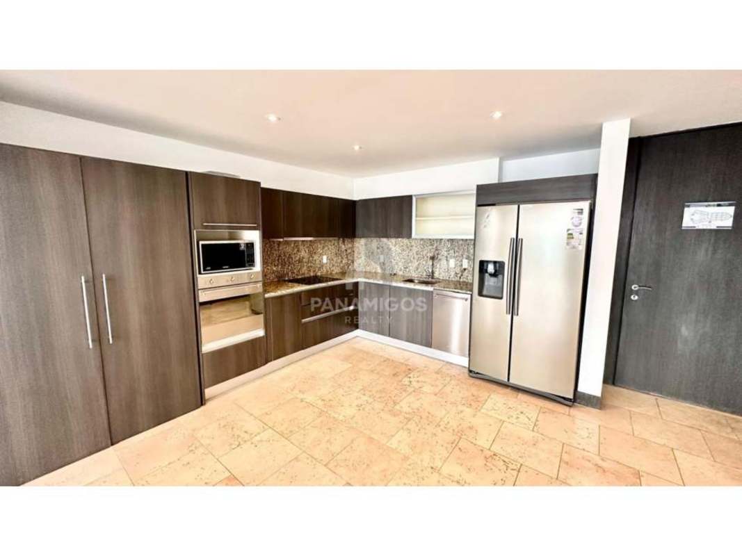 Modern kitchen with granite countertops stainless steel appliances luxury condo The Ocean Club Punta Pacífica Panama