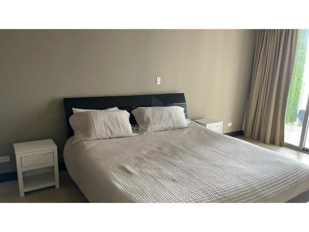 Modern living room with floor-to-ceiling windows and ocean views in The Ocean Club Punta Pacífica