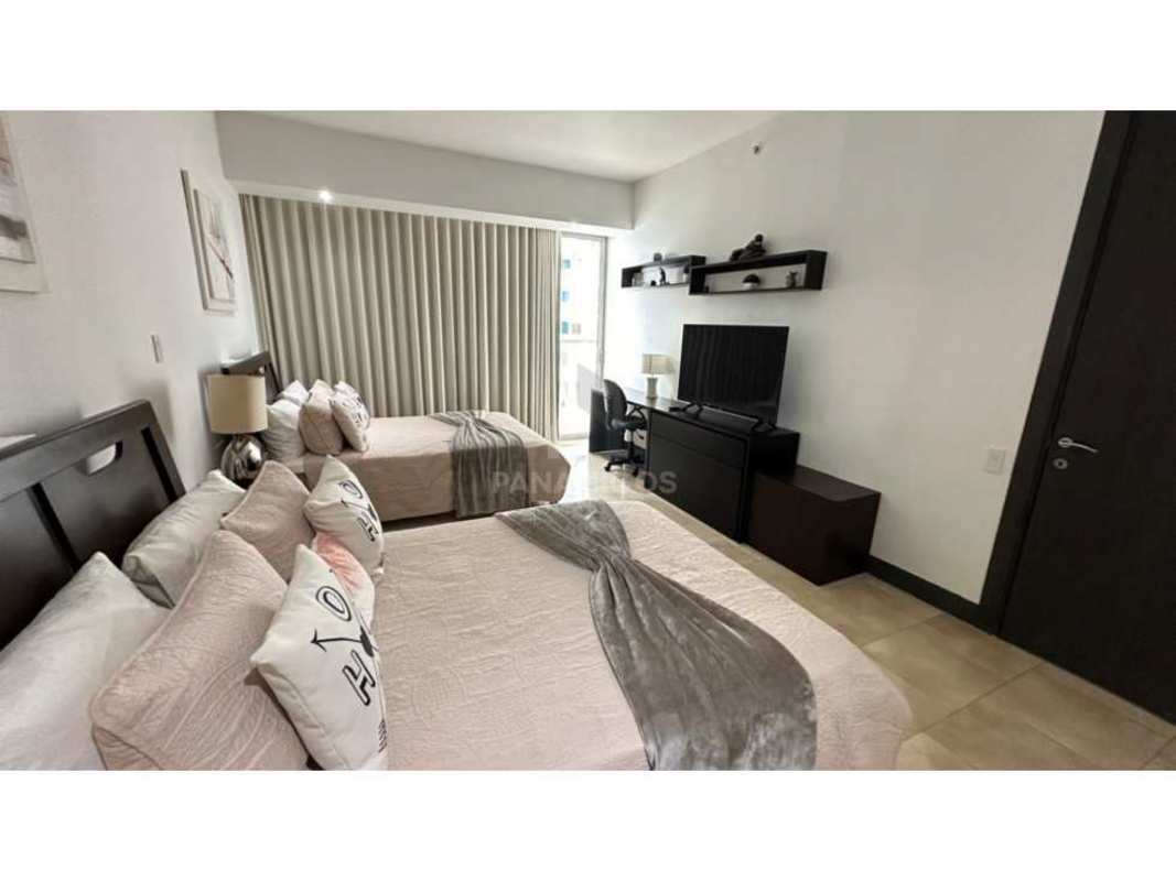 Master bedroom with floor-to-ceiling ocean vista windows The Ocean Club Punta Pacifica luxury apartment