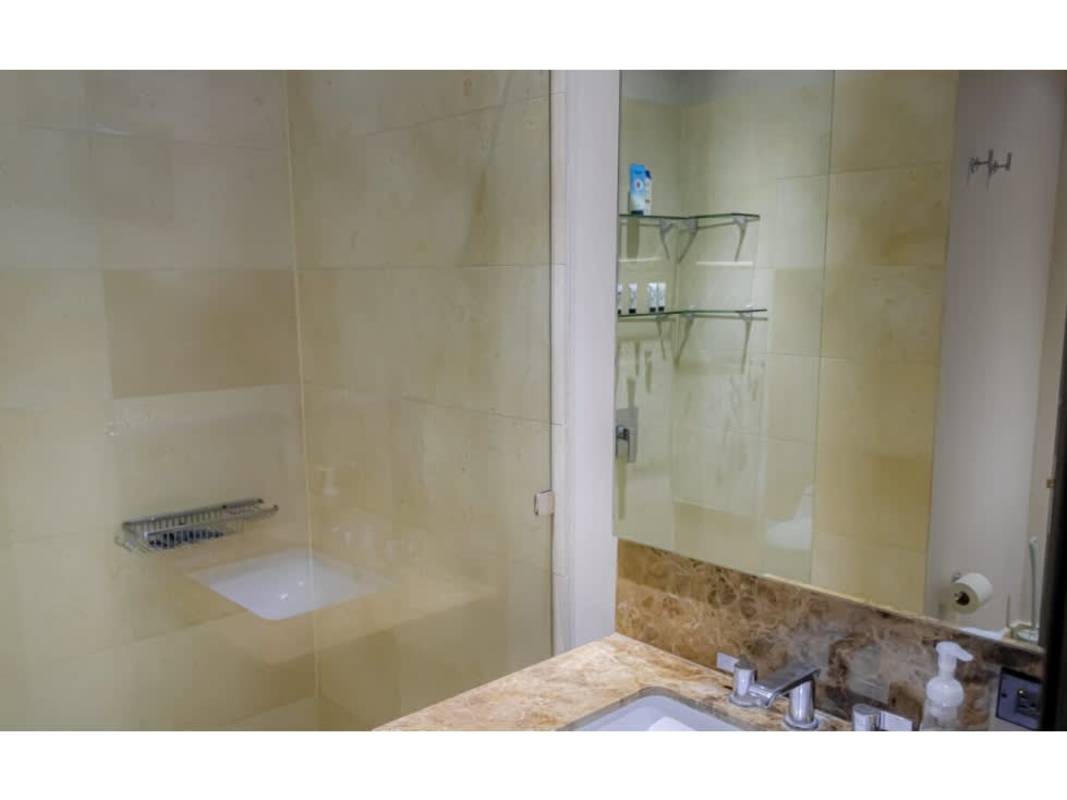 Secondary bedroom with floor-to-ceiling windows, city view at The Ocean Club Punta Pacífica Panama