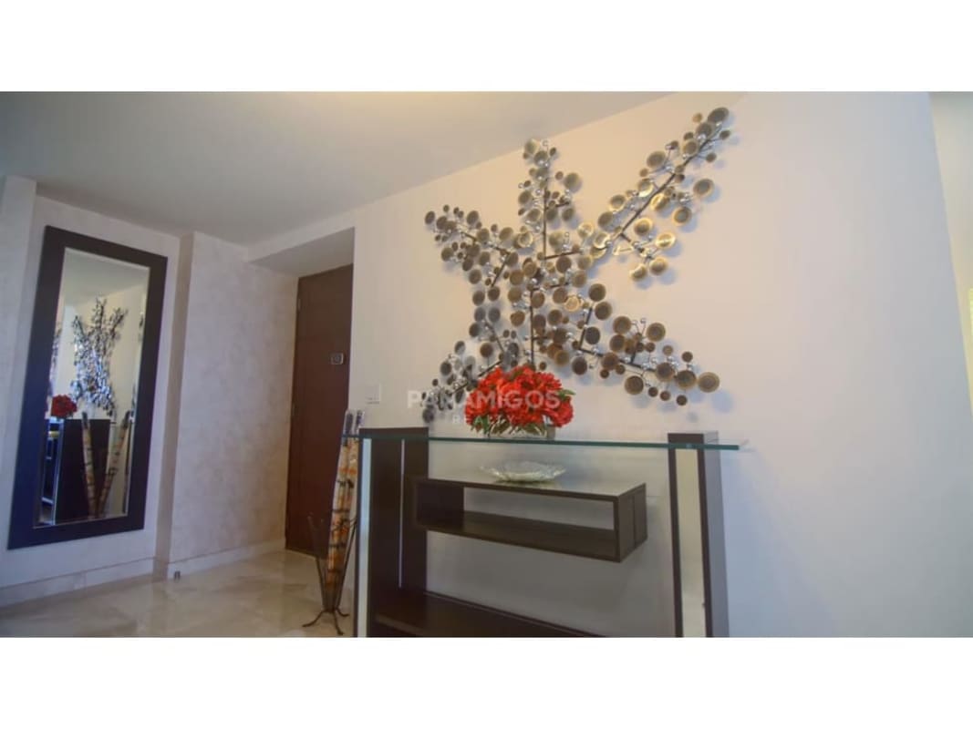 Modern kitchen with granite countertops stainless appliances and dark cabinetry at PH Pacific Village Punta Pacífica Panama