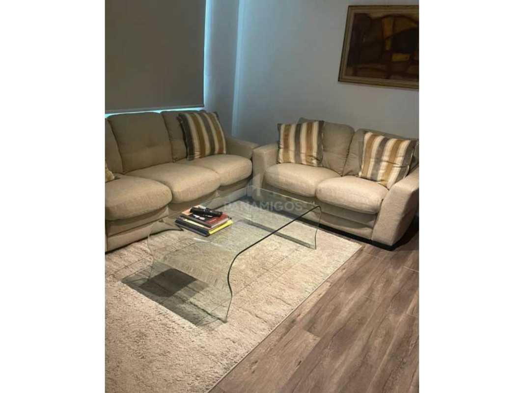 Modern dining room with glass table, upscale finishes, city skyline view in luxury apartment at PH Oceanaire Punta Pacífica