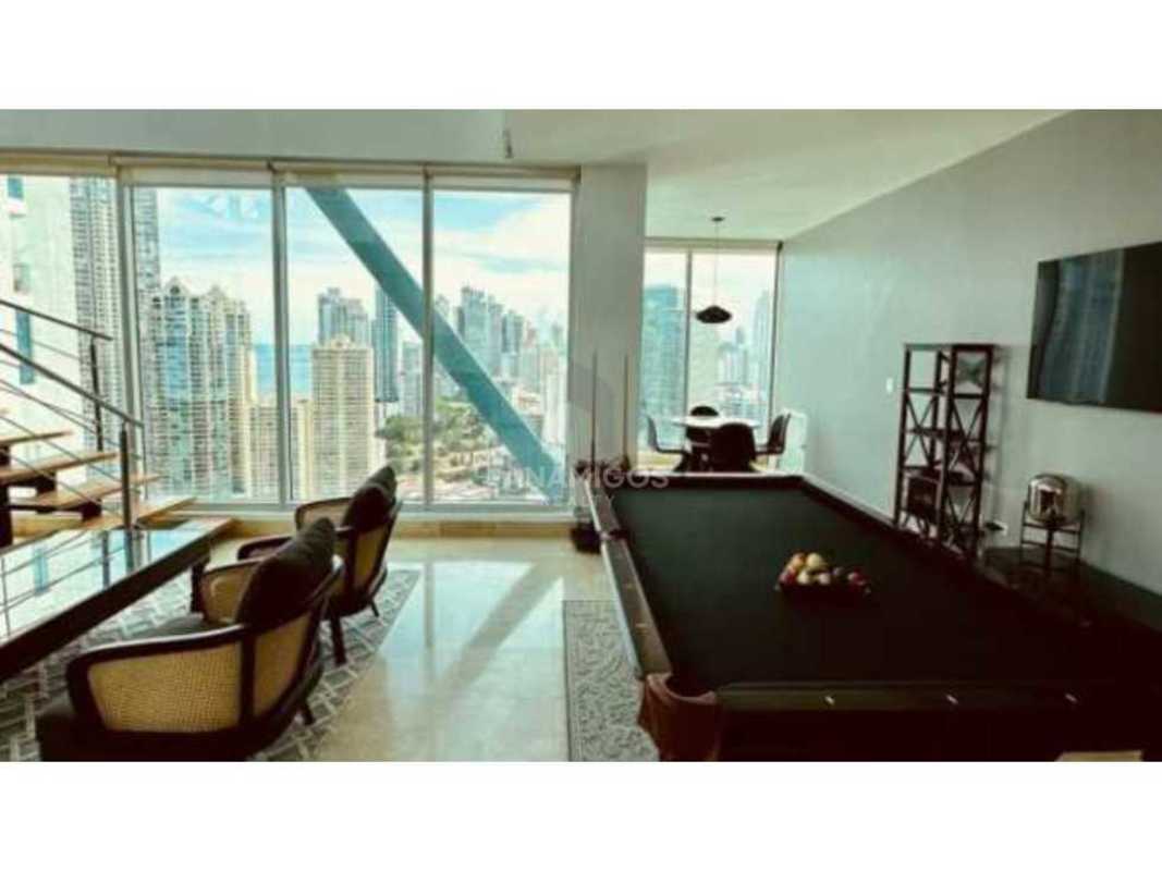 Modern round dining table with city skyline view in PH Loft 4-41 Punta Pacifica Panama