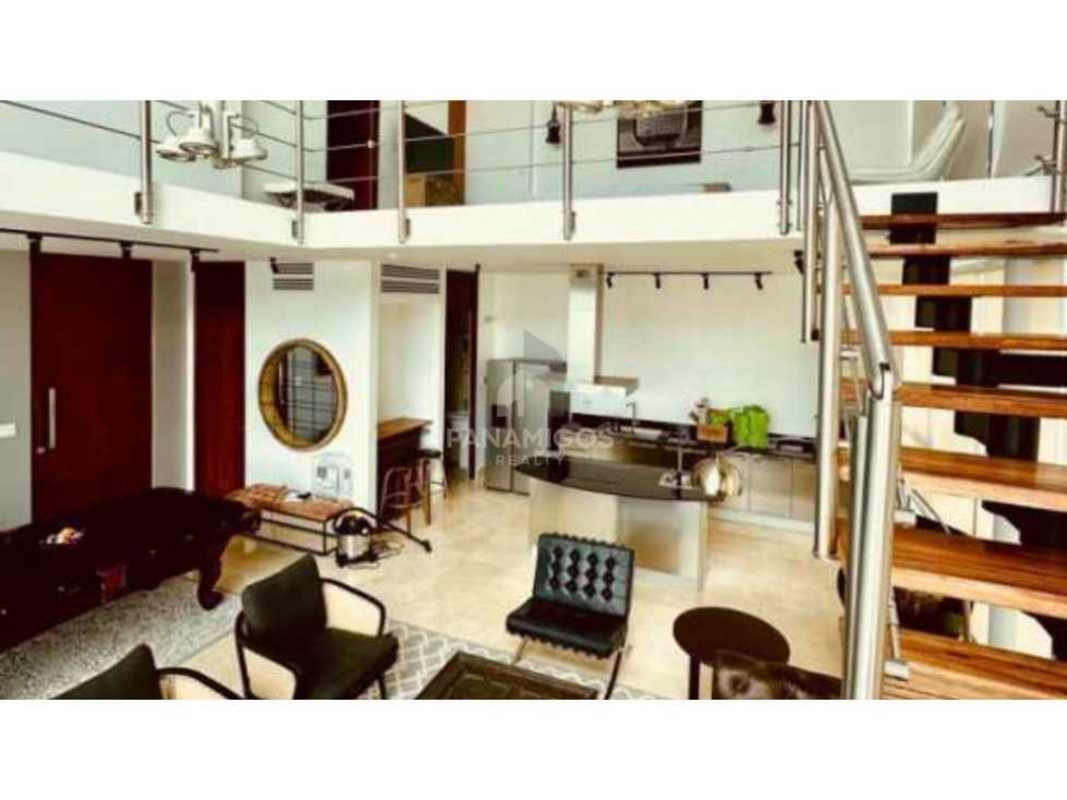 Spacious modern loft with pool table, leather sofa, spiral staircase, city skyline night view Punta Pacifica Panama