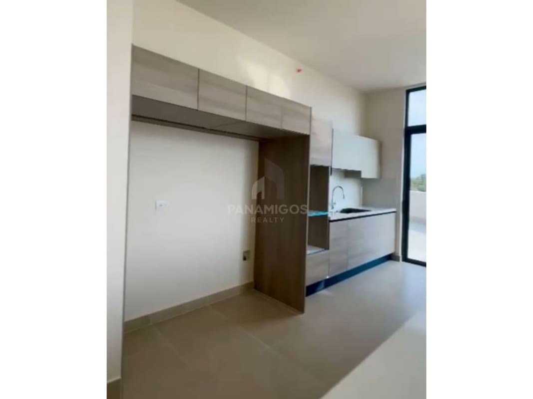 Spacious open living and dining with balcony access and natural light at Ocean House Panama