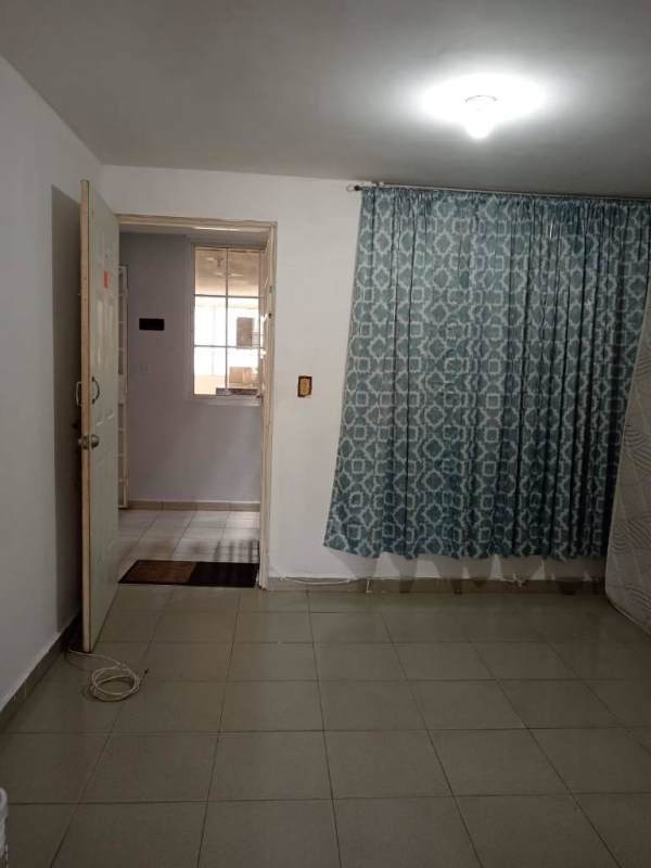 Simple bathroom with walk-in shower pedestal sink white tiles in Juan Díaz apartment Panama