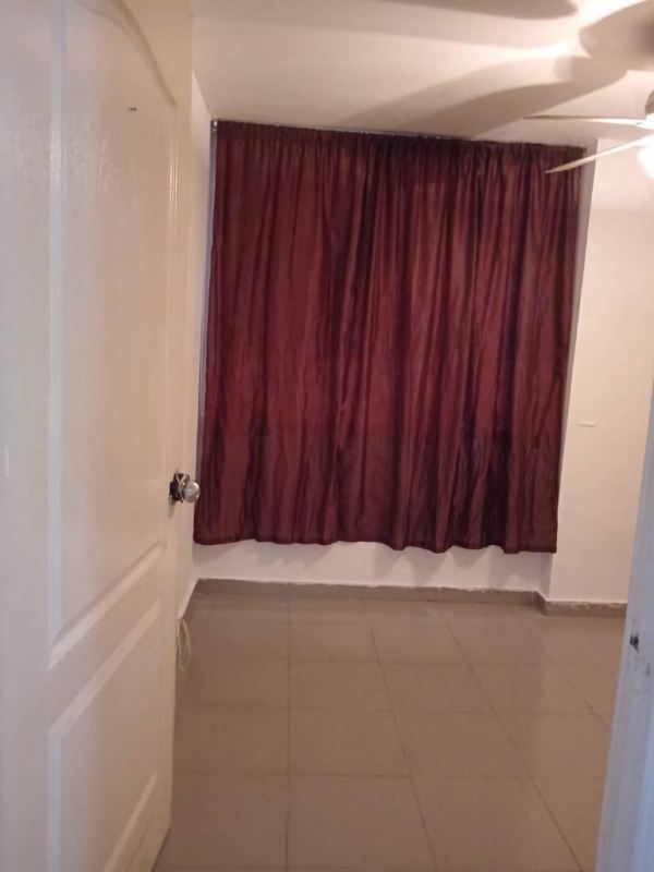 Bedroom with tiled floor ceiling fan brown curtains Juan Díaz apartment Panama
