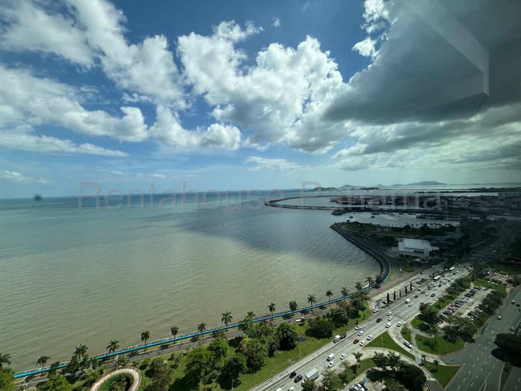 Living space with full-height ocean view windows in PH BICSA Tower Panama City