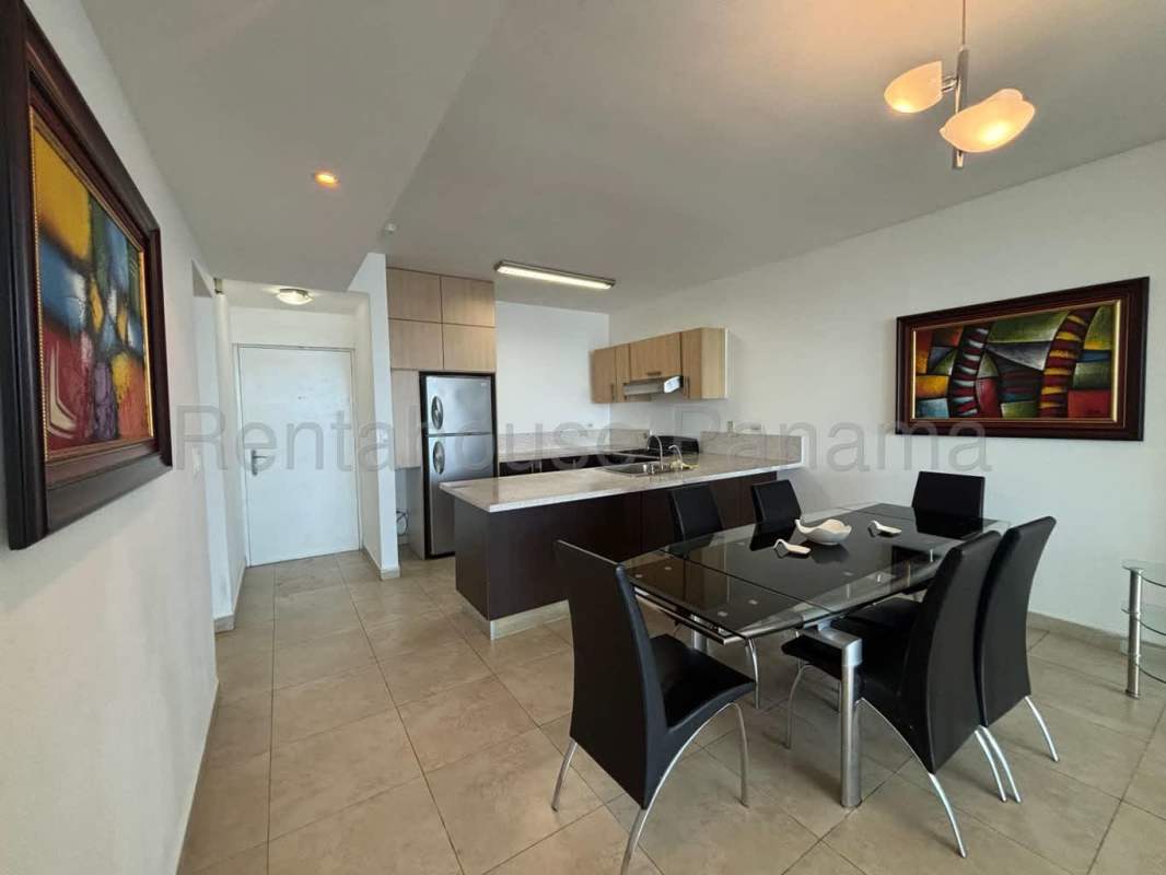 Open concept kitchen with granite countertops and appliances in Avenida Balboa waterfront condo Panama