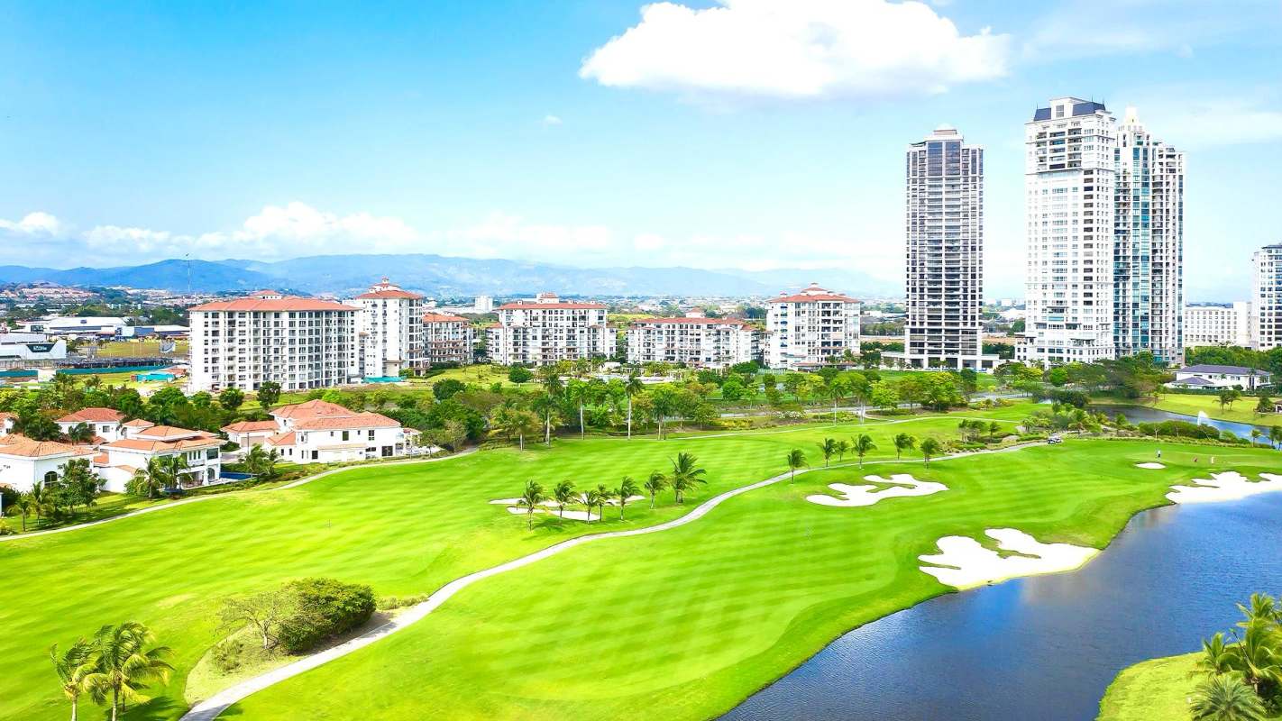 Kitchen with granite counters, marble floors, stainless fridge, and gas stove PH GreenView