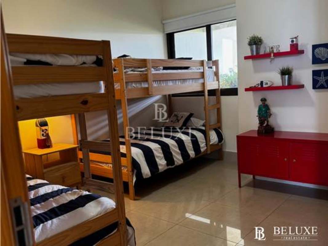 Second bedroom with golf views, AC, closet and en-suite bath in beachfront Casamar apartment