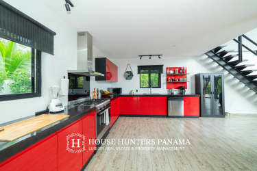 Industrial modern open plan living room with loft and staircase mountain house Panama