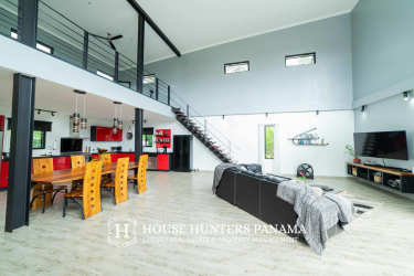 Bedroom with large window overlooking mountain landscape Valle de Anton Panama