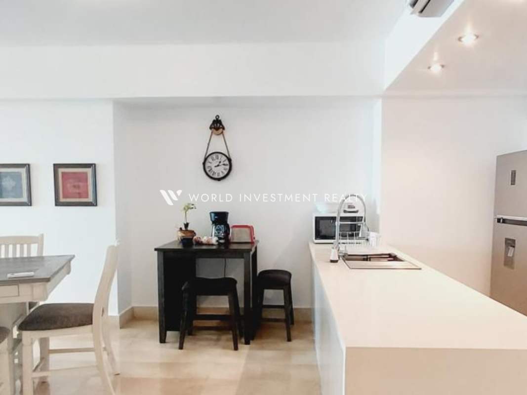 Fully equipped marble kitchen with fridge, microwave, oven at PH YOO Panama