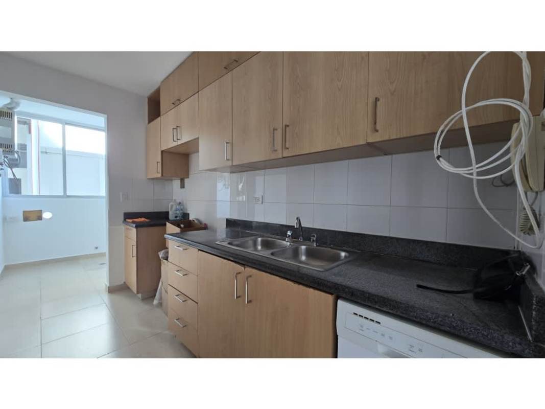 Modern kitchen with granite countertops and light wood cabinets in PH Sol del Este Costa del Este Panama