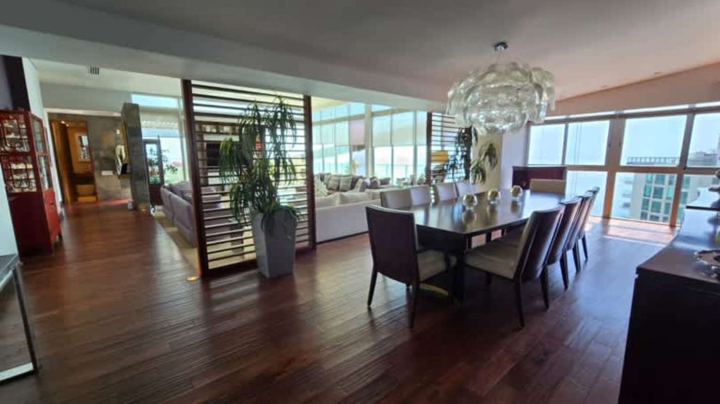 Bedroom with large window, modern decor, city views in penthouse PH Pacific Point Panama